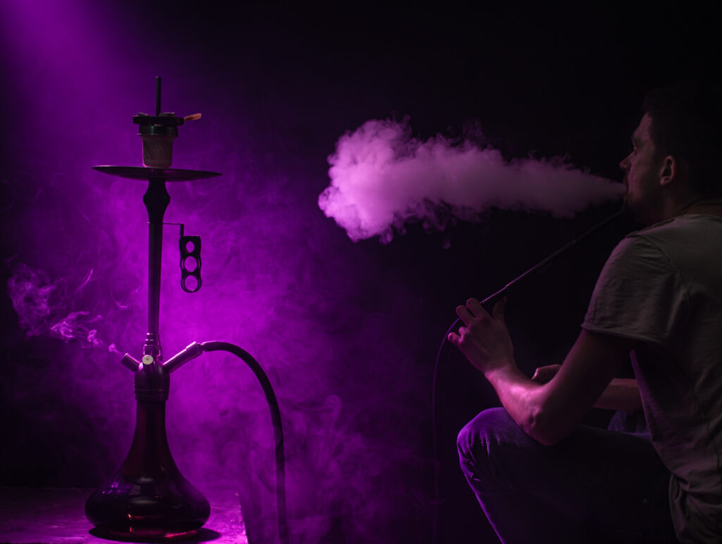 man smoking classic shisha beautiful colored rays light smoke concept hookah smoking